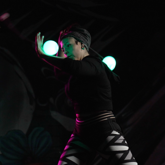 Cassaundra Smyth with flowtoys coral poi