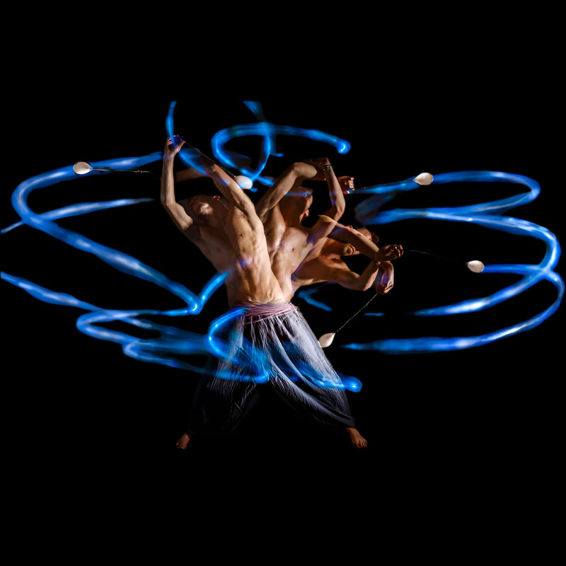 Rom Gai spinning flowtoys LED podpoi with long exposure and blue flash trails