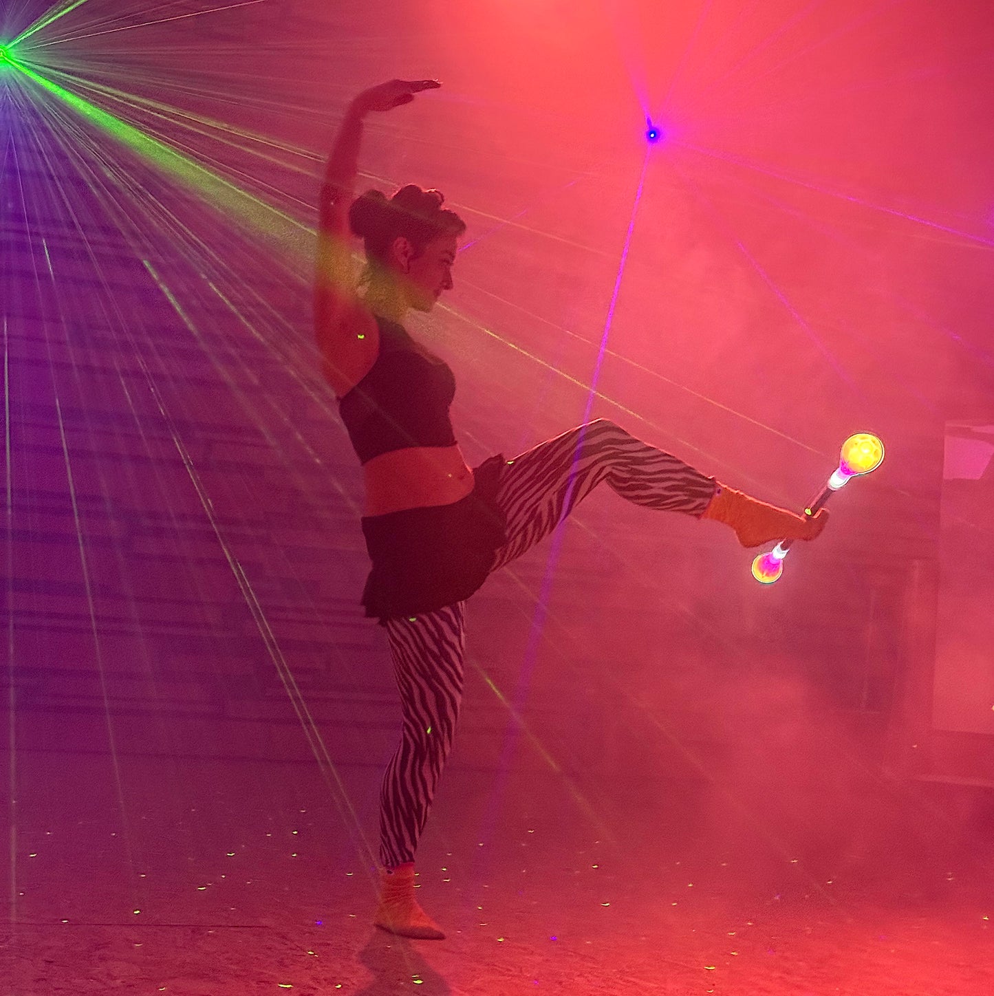 flowtoys pop'n flow LED contact staff with full vision spokes in action for practice, play & performance - modular, full spectrum, multi-pixel & rechargeable w/ lifetime warranty - use the spokes with other hubs to make staffs, dragon staffs, poi, dart, leviwand, and more