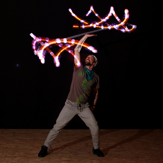 flowtoys trikon dragon staff with capsule lights in action :: epic LED dragon staff for practice & performance :: rechargeable, smart, durable, full spectrum dragon staff with lifetime warranty